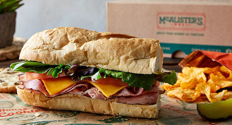 https://www.mcalistersdeli.com/-/media/mcalisters/pages/catering/box-lunches/mca_423628_catering-menu-image_box-lunches_classic_891x480.jpg?v=1&d=20200706T071858Z&la=en&h=480&w=891&hash=1190C90C44AE6B296B93F13E9244CD62